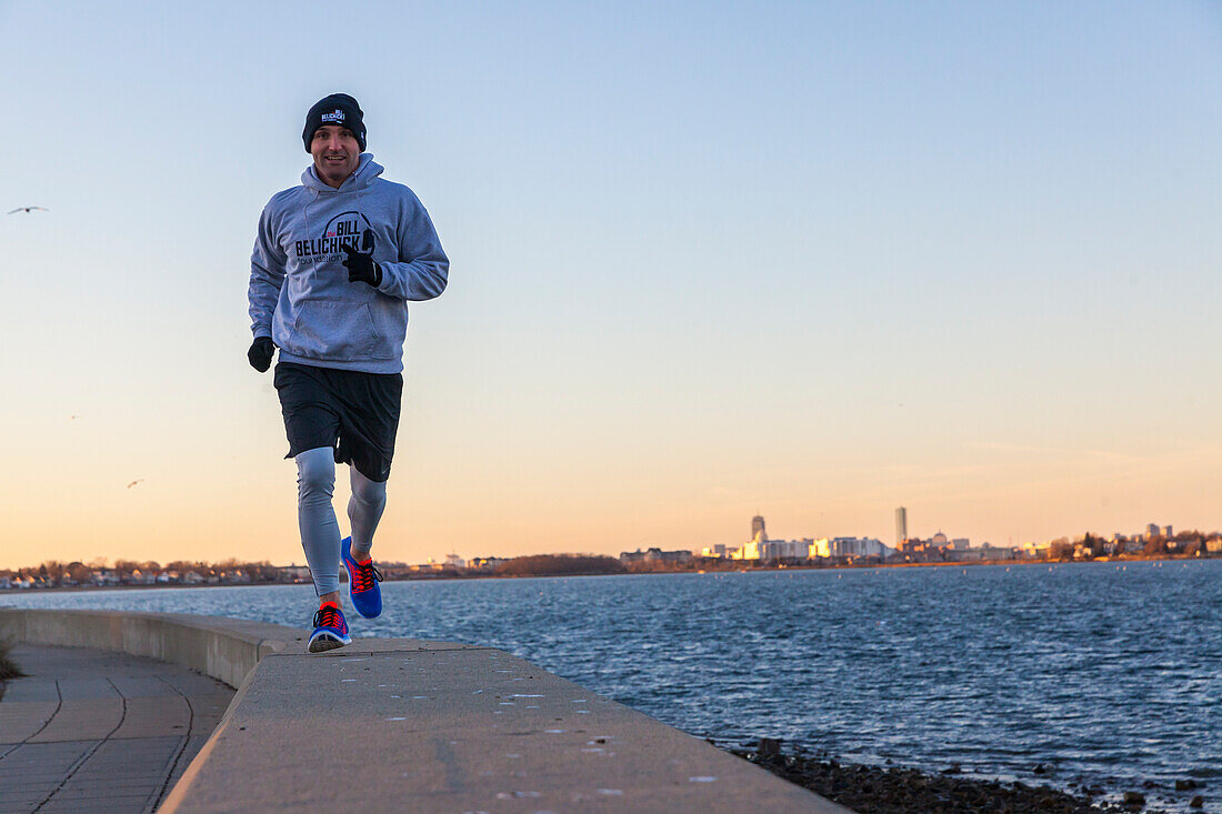 Man is running along the coast