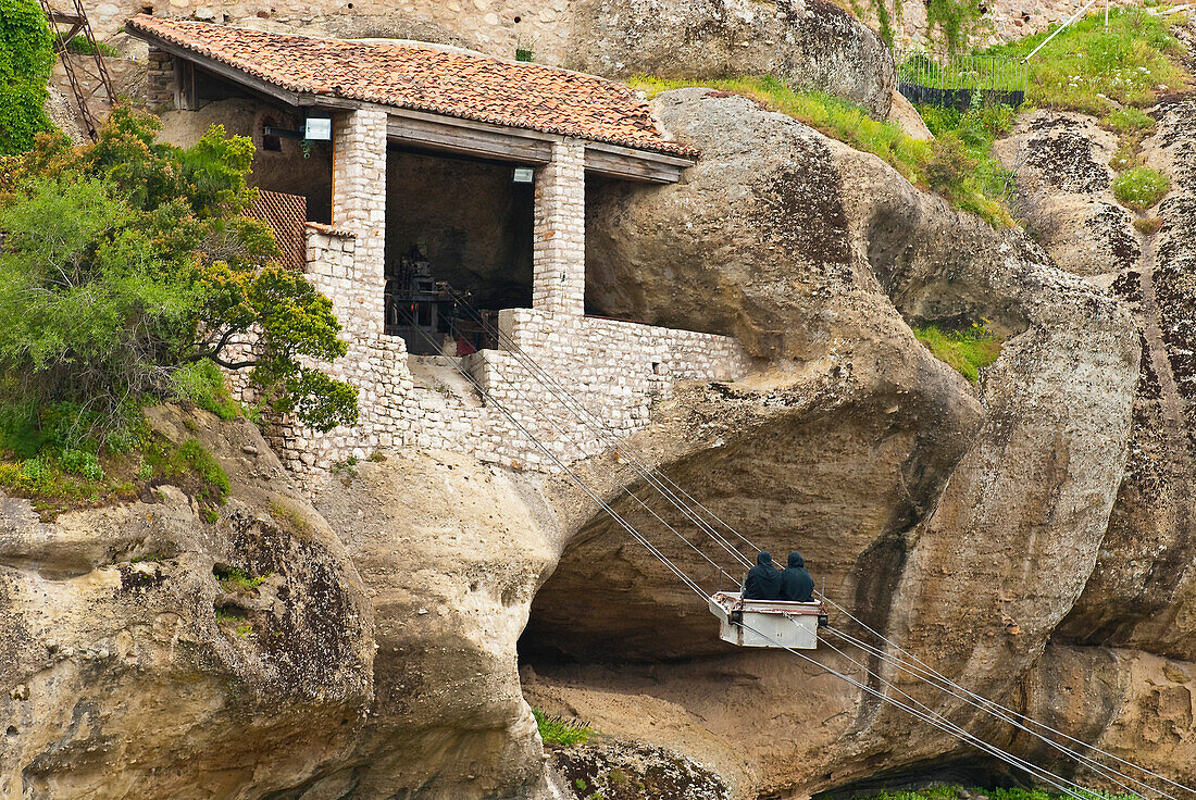 Europe, Grece, Plain of Thessaly, Valley of Penee, World Heritage of UNESCO since 1988, Orthodox Christian monasteries of Meteora perched atop impressive gray rock masses sculpted by erosion, Monastery of Varlaam, monks going from one side to the other