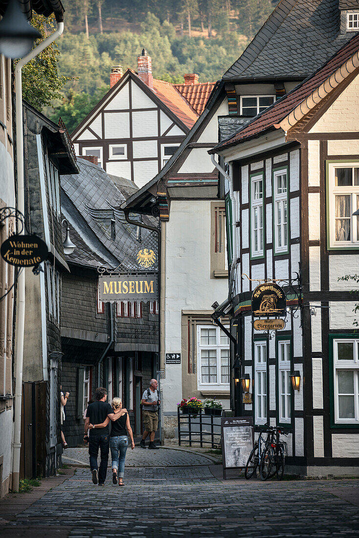 UNESCO World Heritage historic old town of Goslar, couple in love strolling through small alleys of the old town, Harz mountains, Lower Saxony, Germany