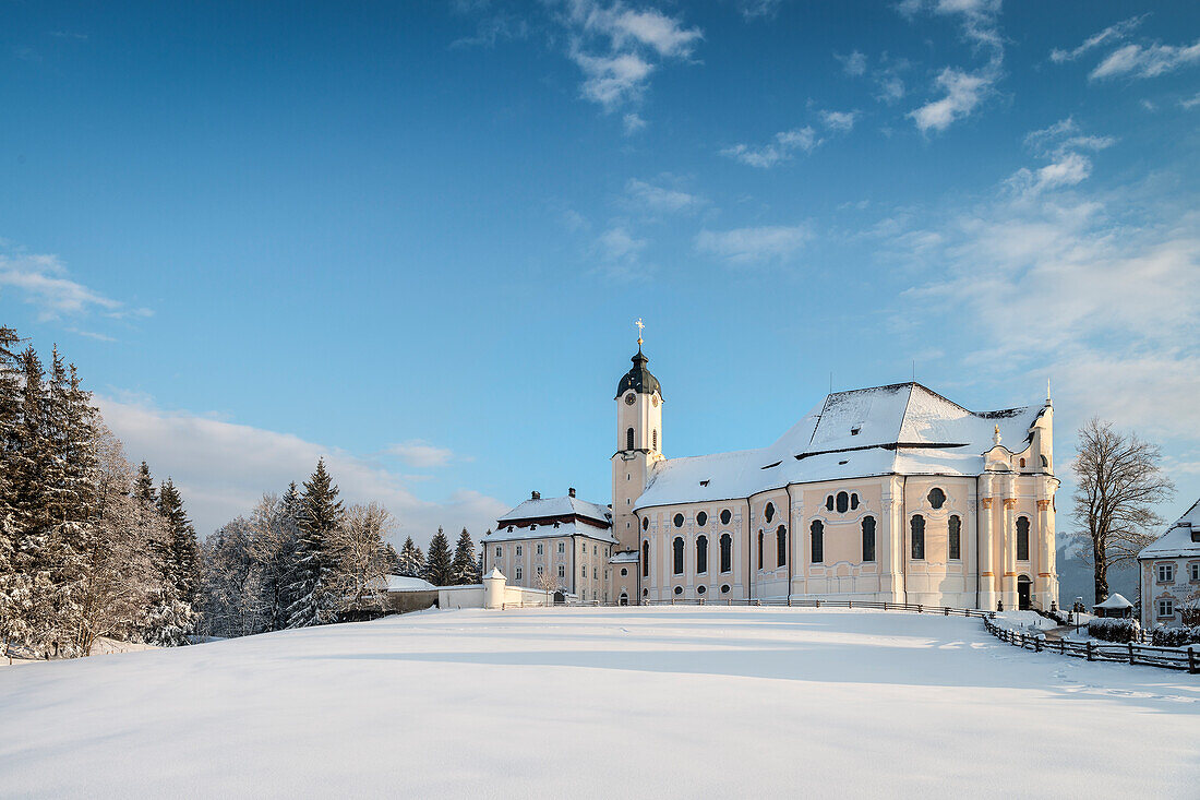 UNESCO World Heritage Wies Church, pilgrimage church surrounded by snow, Steingaden, Bavaria, Germany