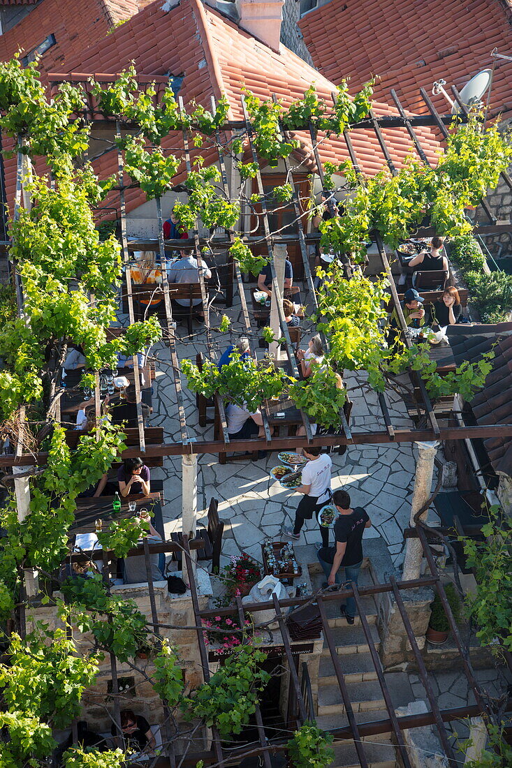 Roof terrace of Konoba Lady Pi Pi restaurant in Dubrovnik Old Town seen from city wall, Dubrovnik, Dubrovnik-Neretva, Croatia