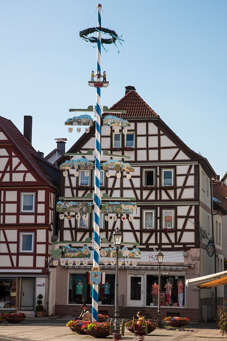 Maibaum may pole and half-timbered house in Altstadt old town, Bad Orb, Spessart-Mainland, Hesse, Germany