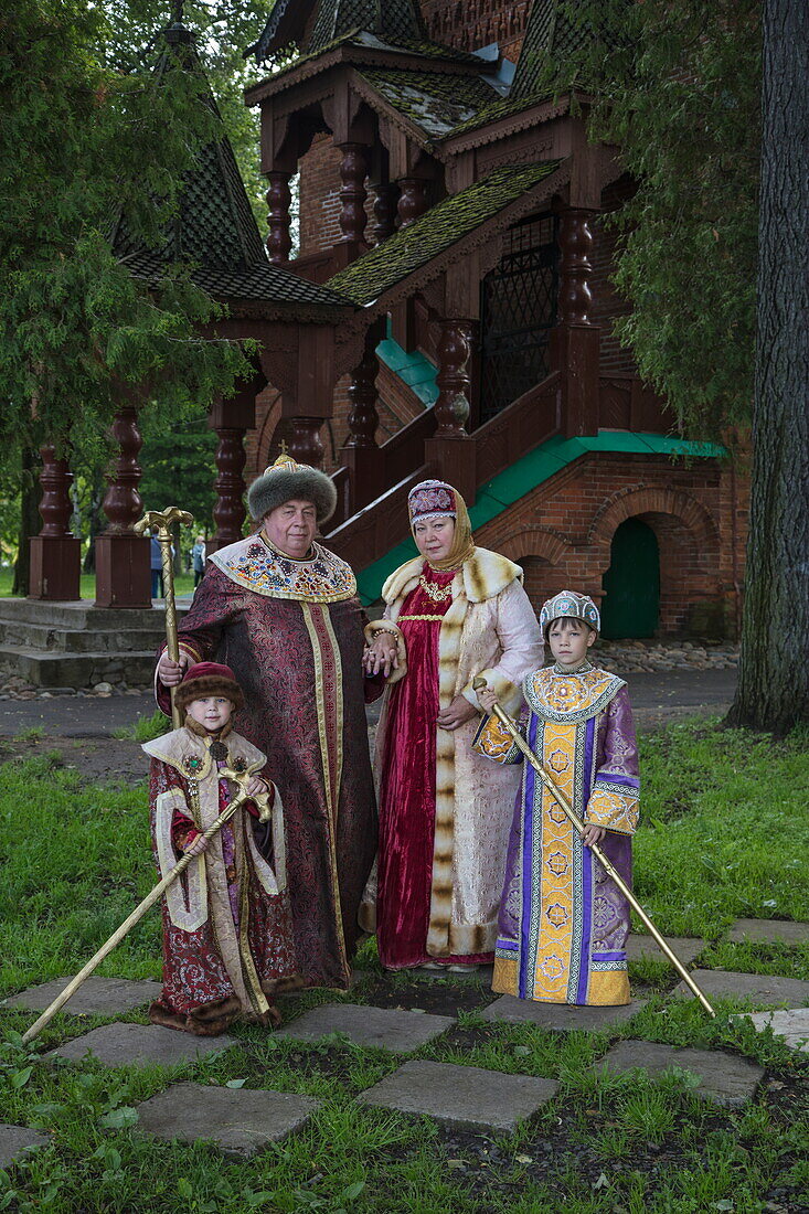 Family in traditional period costumes pose for photographer, Uglich, Russia