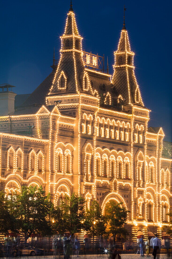 Illuminated Exerior of GUM department store and shopping arcade at dusk, Moscow, Russia