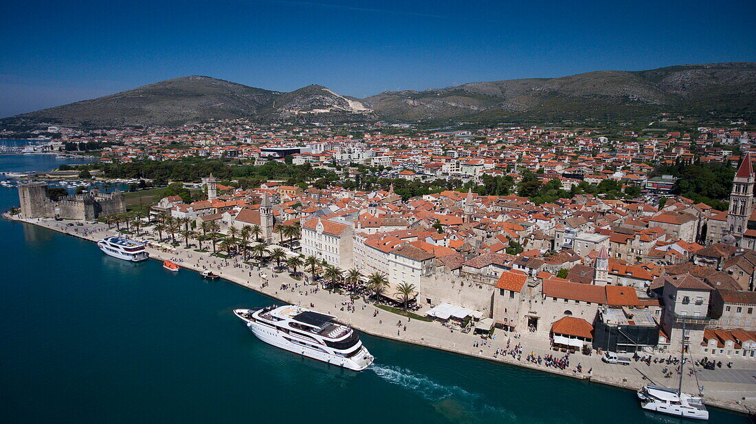Aerial of cruise ship MS Romantic Star (Reisebüro Mittelthurgau) and Old Town rooftops, Trogir, Split-Dalmatia, Croatia