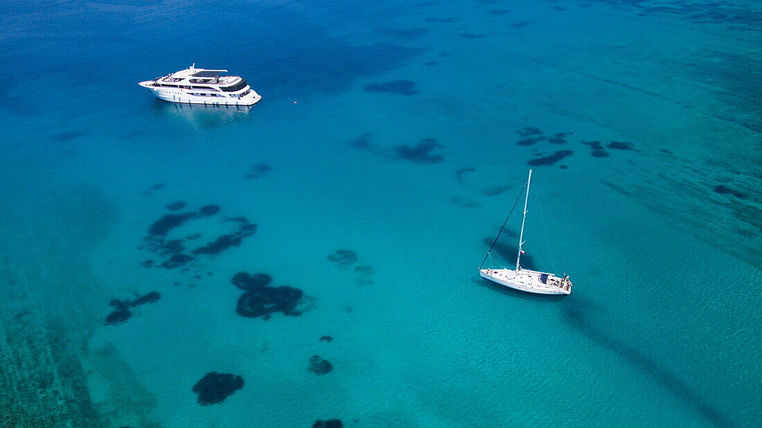 Aerial of cruise ship MS Romantic Star (Reisebüro Mittelthurgau) and sailboat in turqoise waters, near Kor?ula, Dubrovnik-Neretva, Croatia