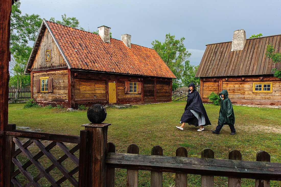 People with rain cape in the Bunge open air museum, Schweden