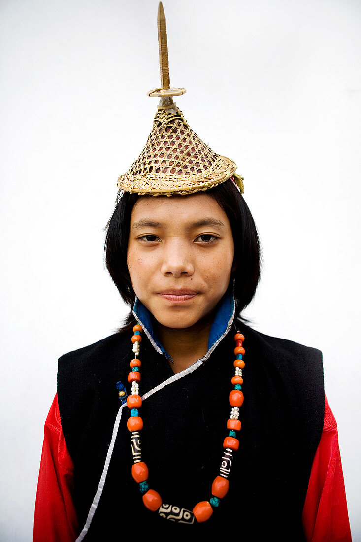 Asian girl wearing a traditional hat