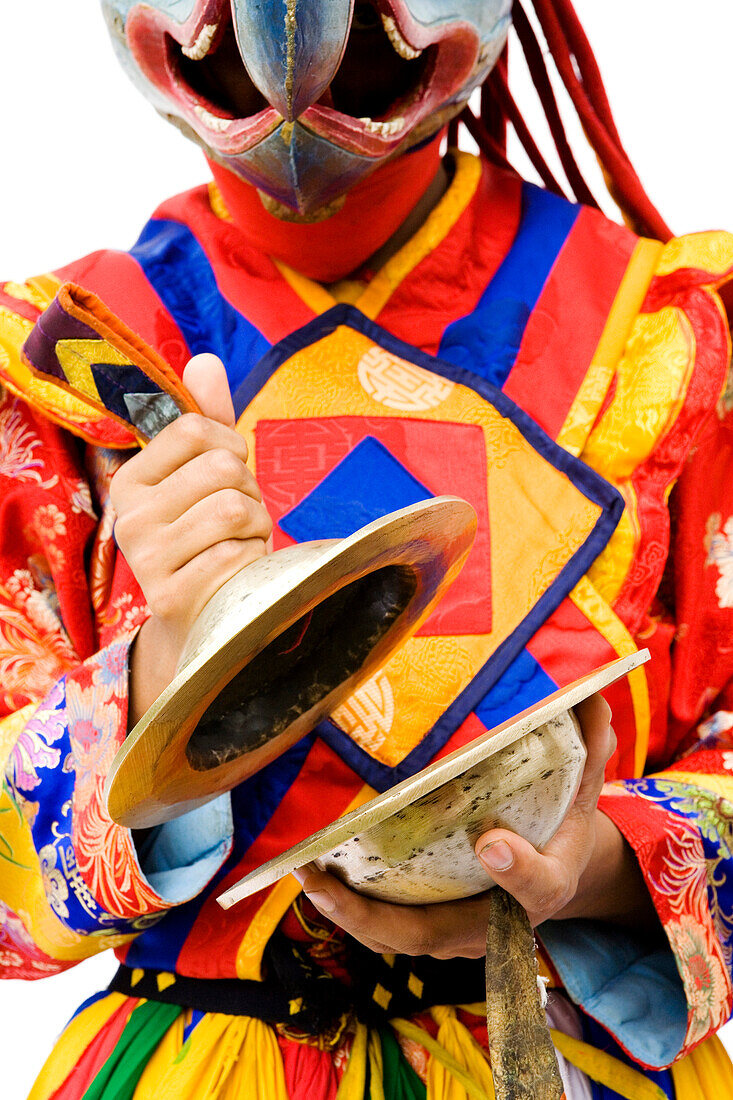 Asian man wearing mask playing musical instrument