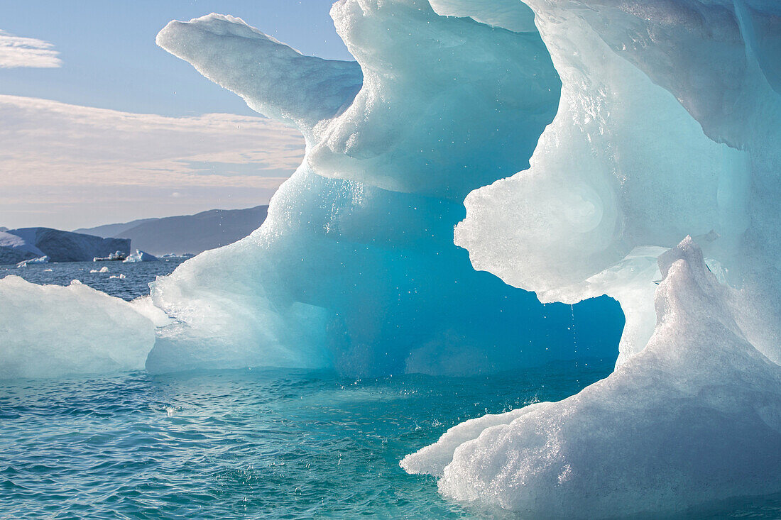 icebergs that separated from the glacier snouts, strangely shaped block of ice, fjord of narsaq bay, greenland