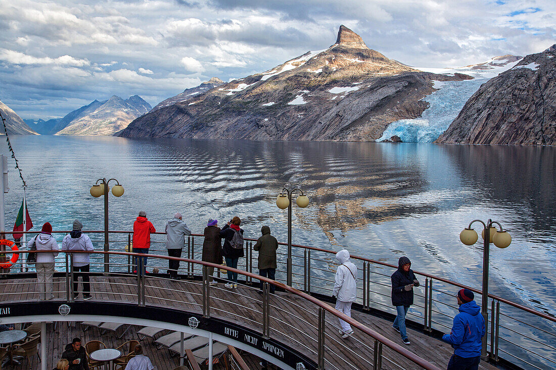 passengers on the ocean liner's deck to admire the landscape, the blue glacial snout of the glacier, astoria cruise ship, fjord in the prince christian sound, greenland