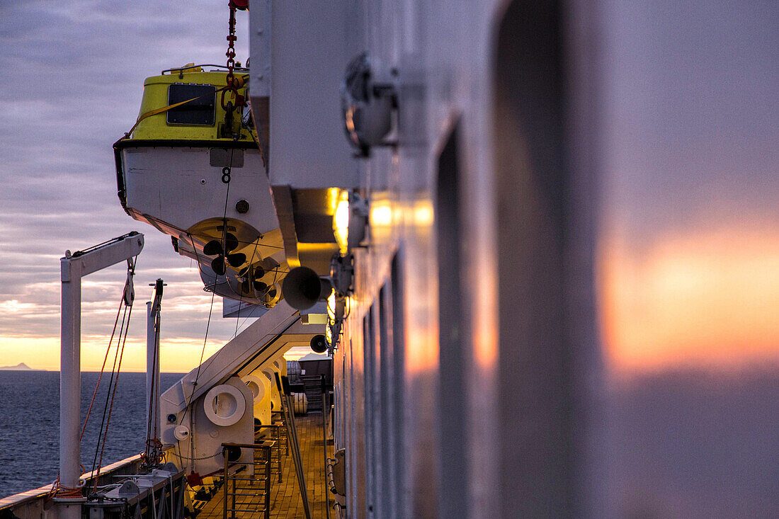 sunset over the ship's upper deck, astoria cruise ship by the icelandic coast, iceland
