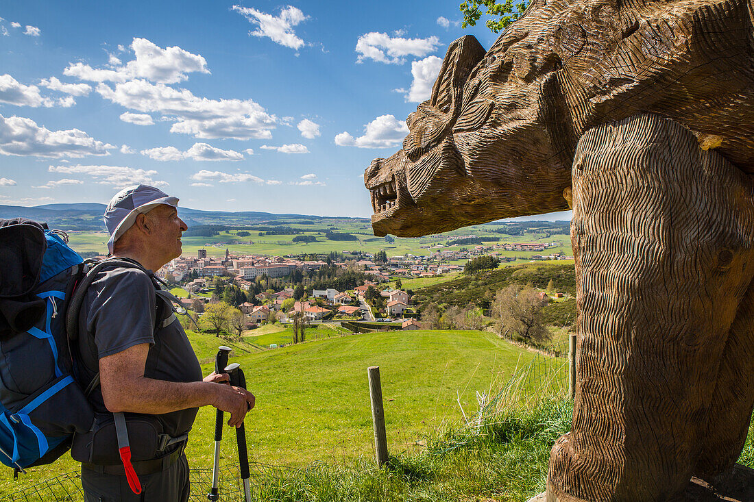 pilgrims on the way of saint james, sculpture of the man-eater of gevaudan above saugues, (43), haute loire, auvergne rhone alpes region, france