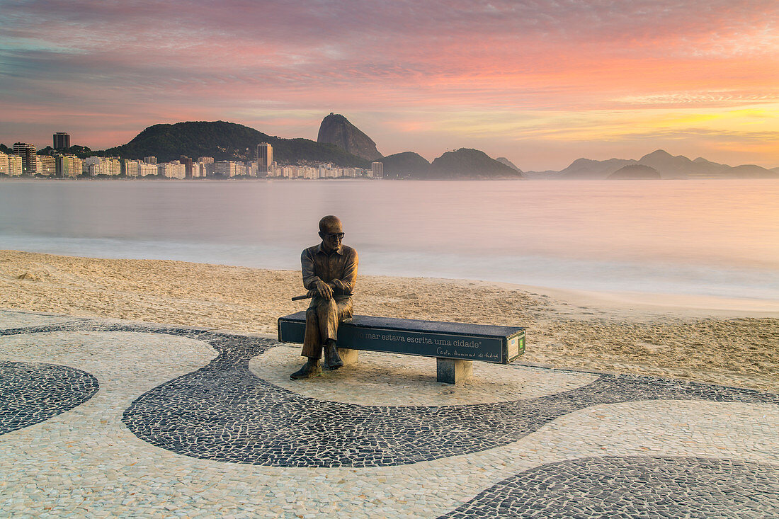 Brazilian poet Carlos Drummond de Andrade statue at Copacabana beach sidewalk, Rio de Janeiro, Brazil, South America