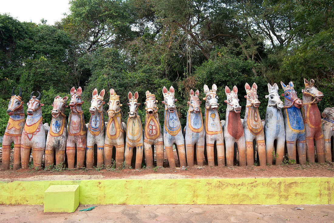 Terracotta horses, each a votive offering to village guardian deity, Ayyanar, at the Solai Andavar shrine, Palathur, Tamil Nadu, India, Asia