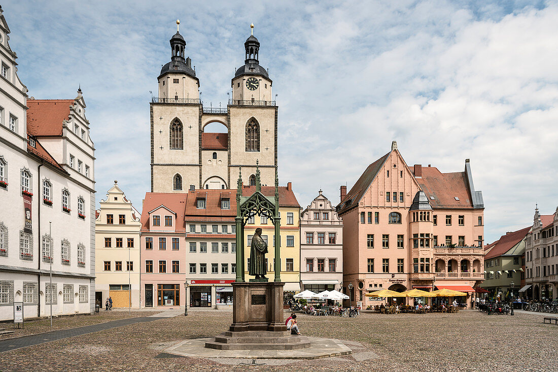UNESCO World Heritage Martin Luther towns, town church an Statue of Martin Luther at market square at Wittenberg, Saxony-Anhalt, Germany