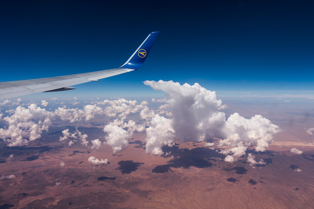 Aerial of wing and winglet of Condor B-767-300ER (D-ABUB) during flight from Frankfurt to Las Vegas with cloud and desert landscape, above Utah, USA