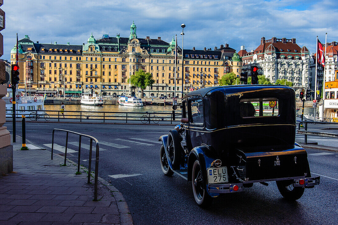 noble houses on the beach and vintage cars in the foreground, Stockholm, Sweden