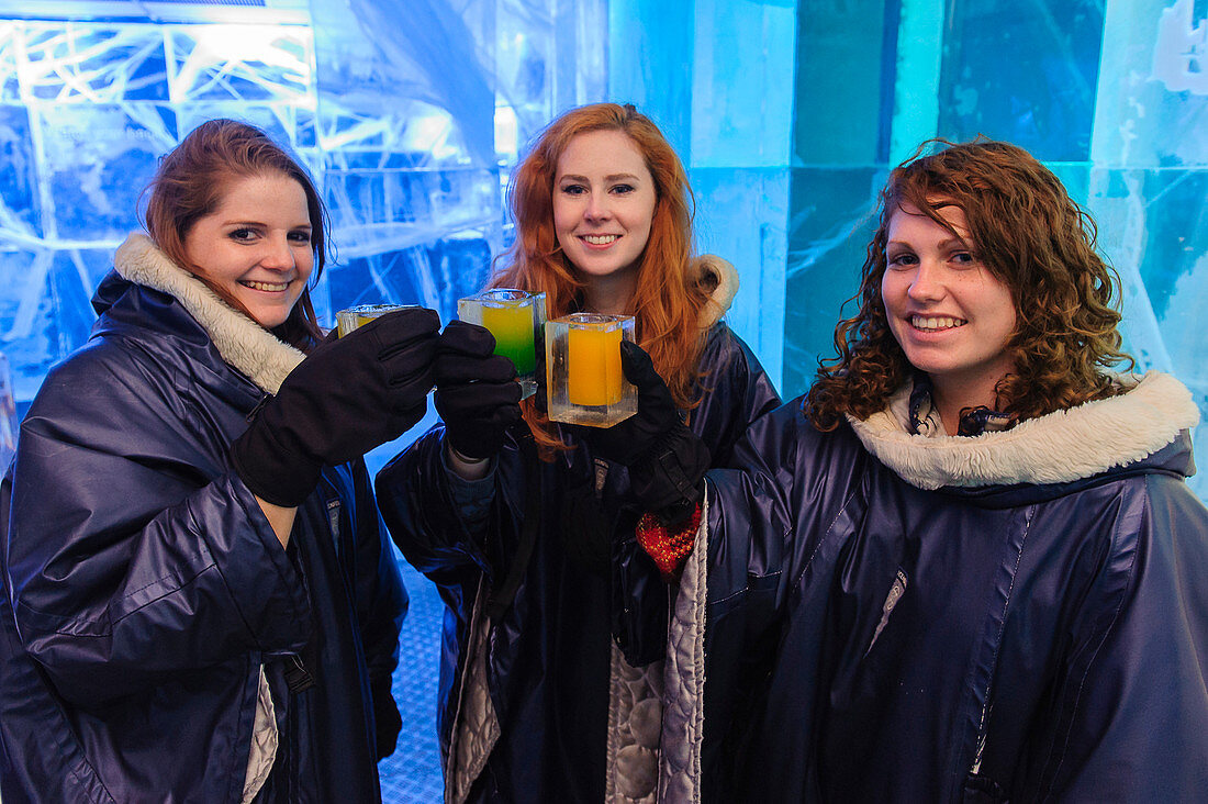 Young women from America in the Absolute Ice Bar, Stockholm, Sweden