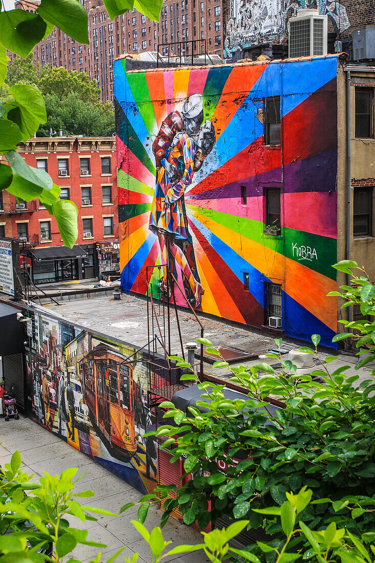 mural on a wall in the meatpacking district seen from the plant-filled high line promenade, manhattan,manhattan, new york city, state of new york, united states, usa
