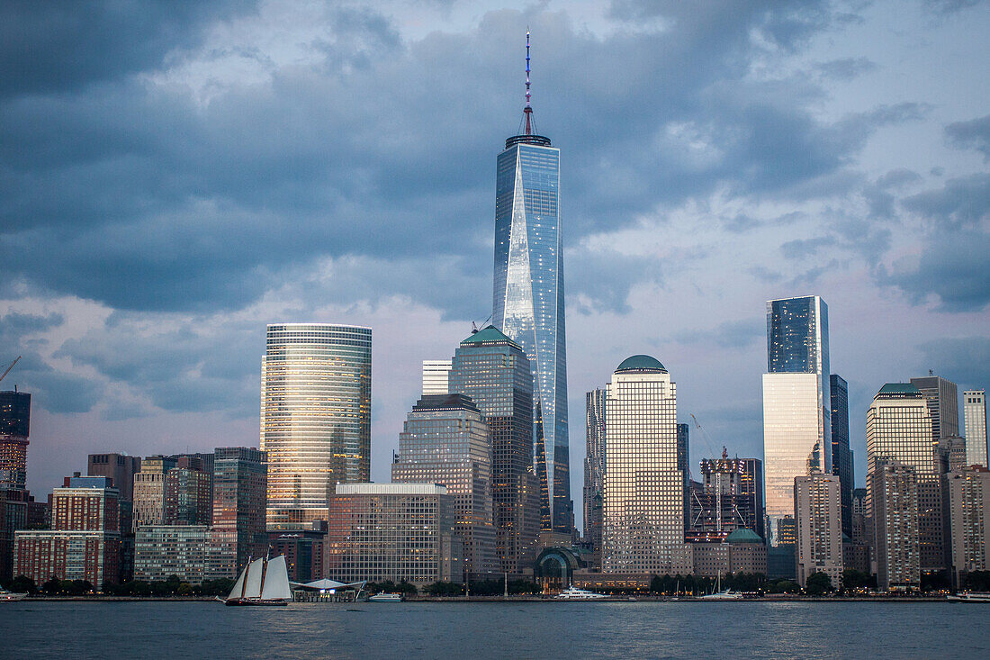 blue hour over the skyline of the financial district of new york with one world trade center dominating the cityscape, view from jersey city, manhattan, new york city, state of new york, united states, usa