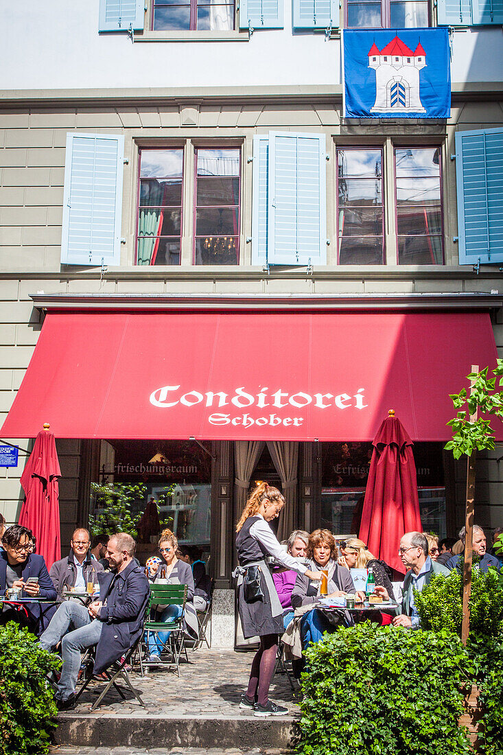 customers on the terrace of the famous teahouse schober in the old town of zurich, canton of zurich, switzerland