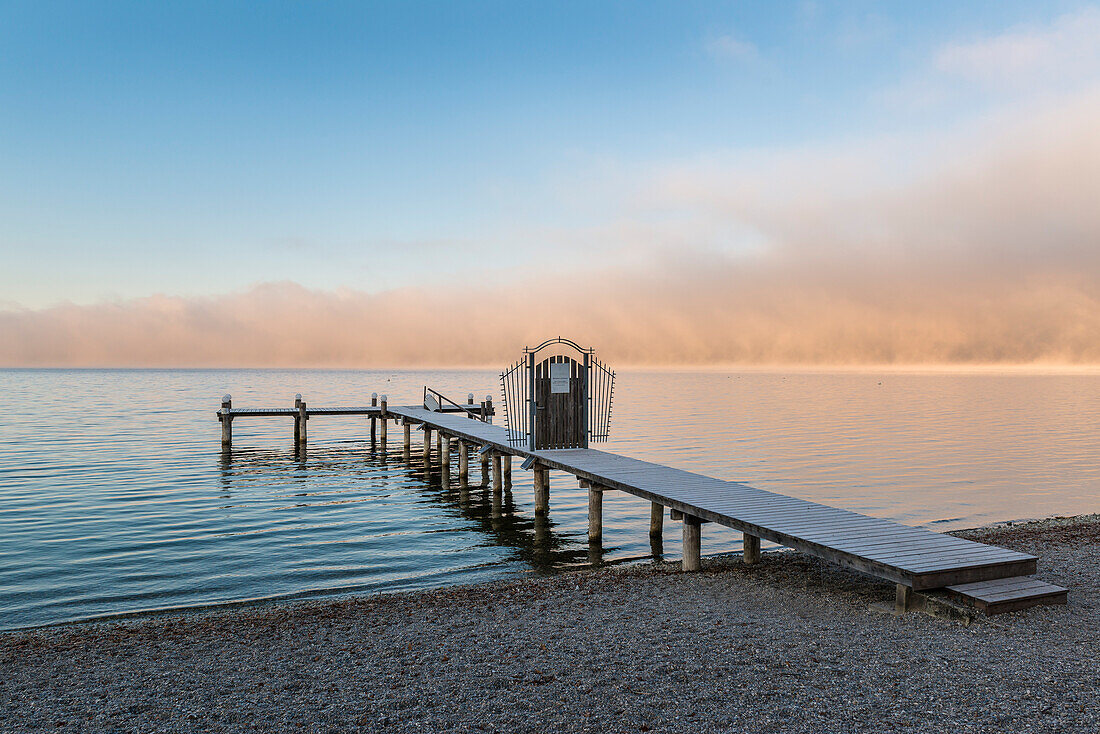 sea fog in the morning at lake Ammersee, Herrsching, Bavaria, Germany