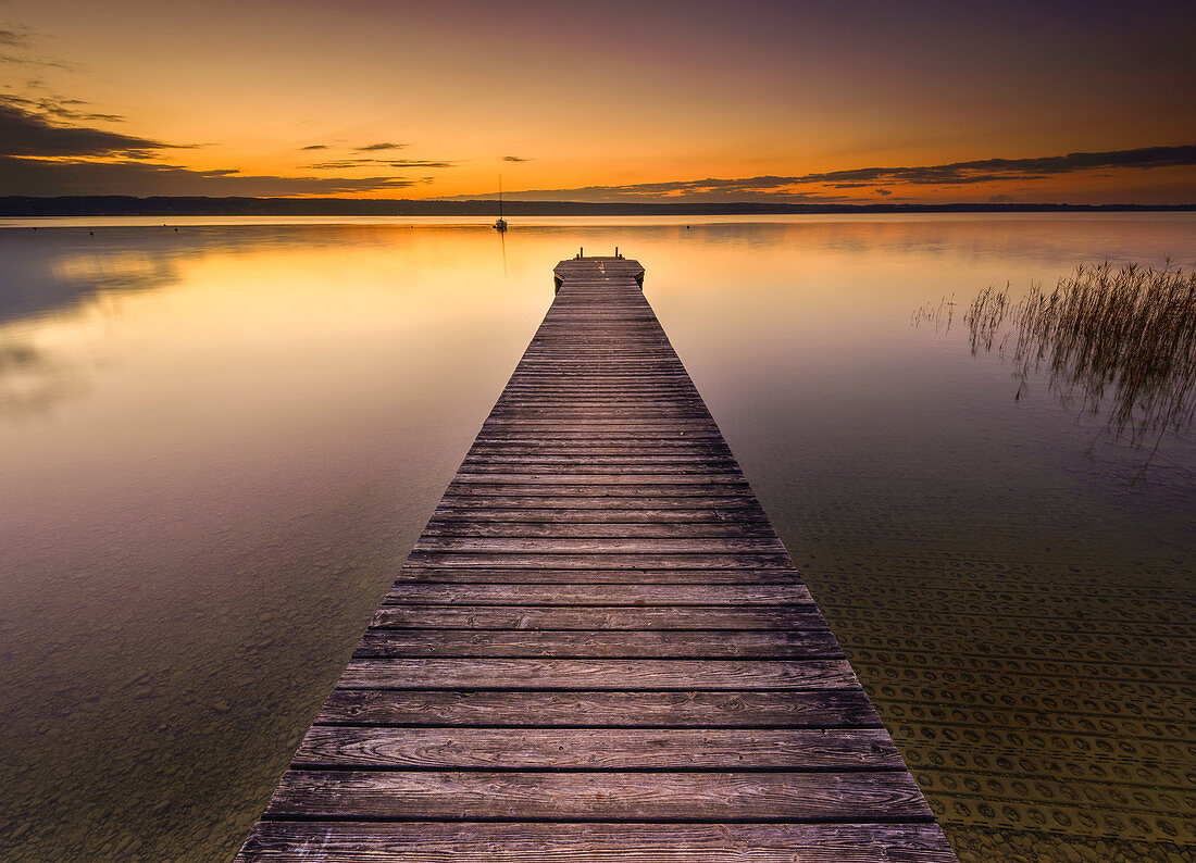 long jetty at the east bank of lake Ammersee, Bavaria, Germany