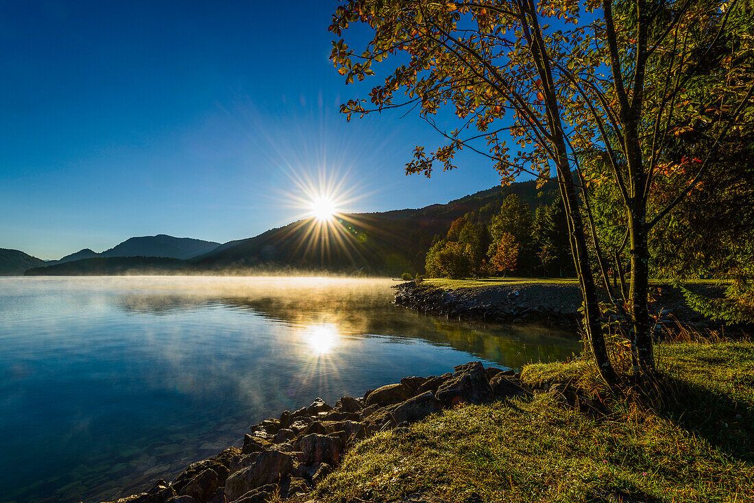 sunrise in autumn at lake Walchensee, Bavaria, Germany