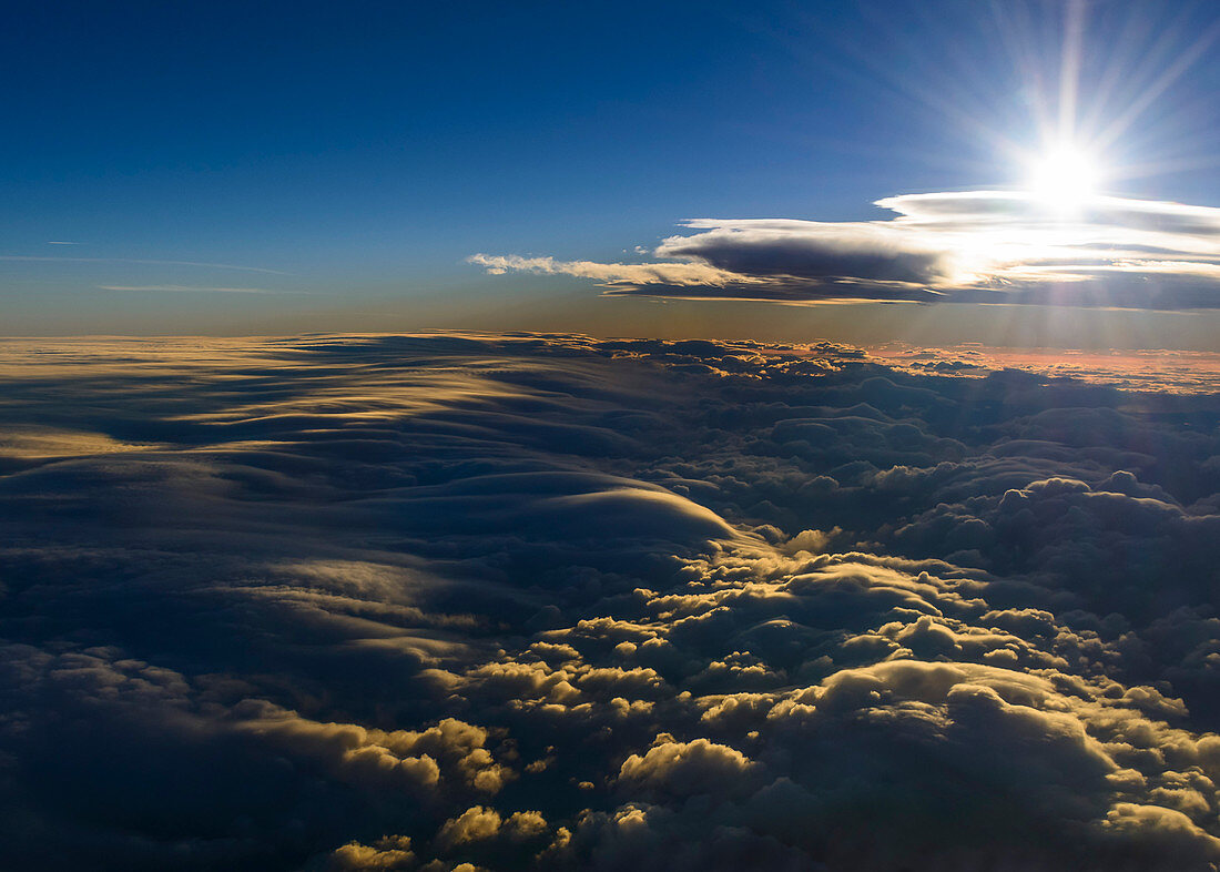 light and shadow above a sea of clouds