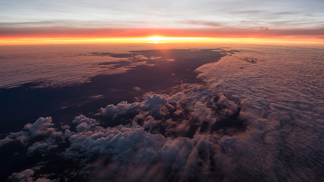 sunset from a bird's-eyes view above the high inversion fog, northern Germany