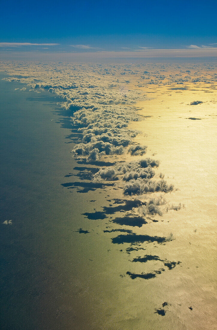 cloud formation in golden light above the south atlantic ocean