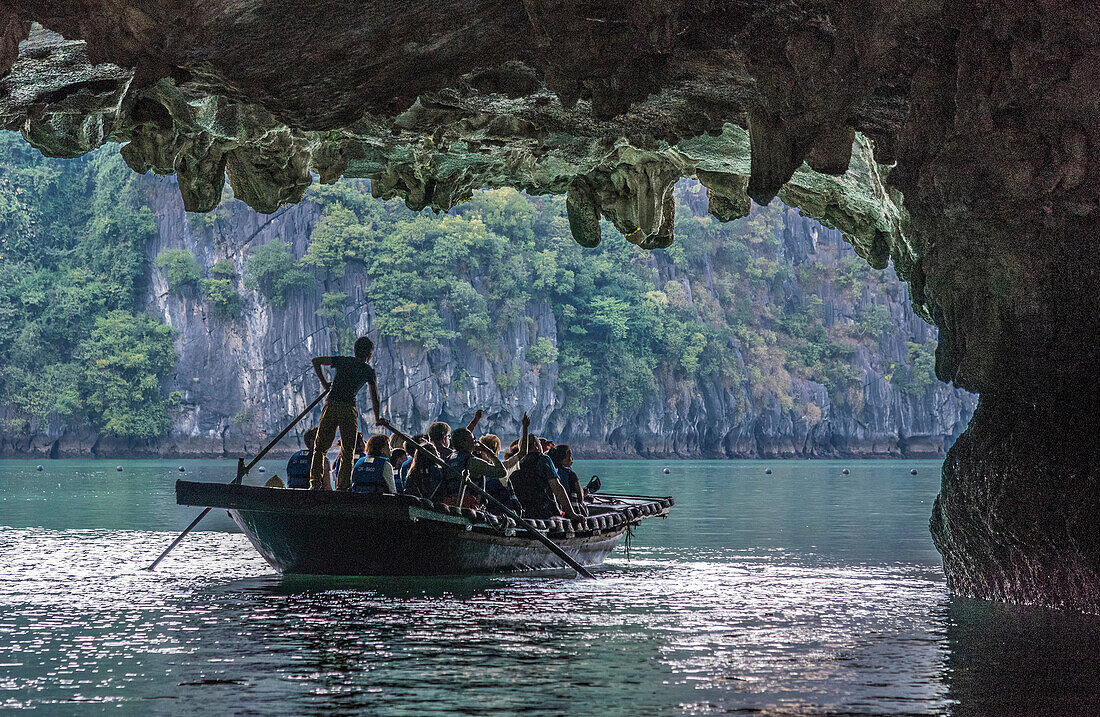 Vietnam, Ha Long Bay, the Tunnel Cave, tourists small boat (UNESCO World Heritage)