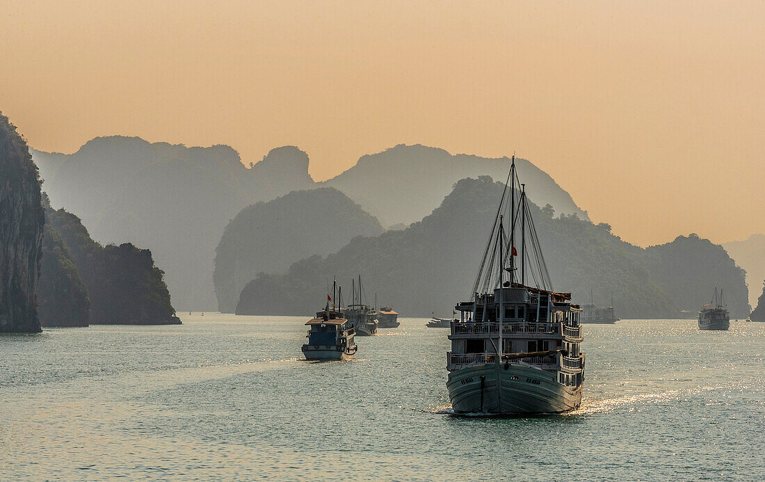 Vietnam, Ha Long Bay at sunset, cruise boat (UNESCO World Heritage)