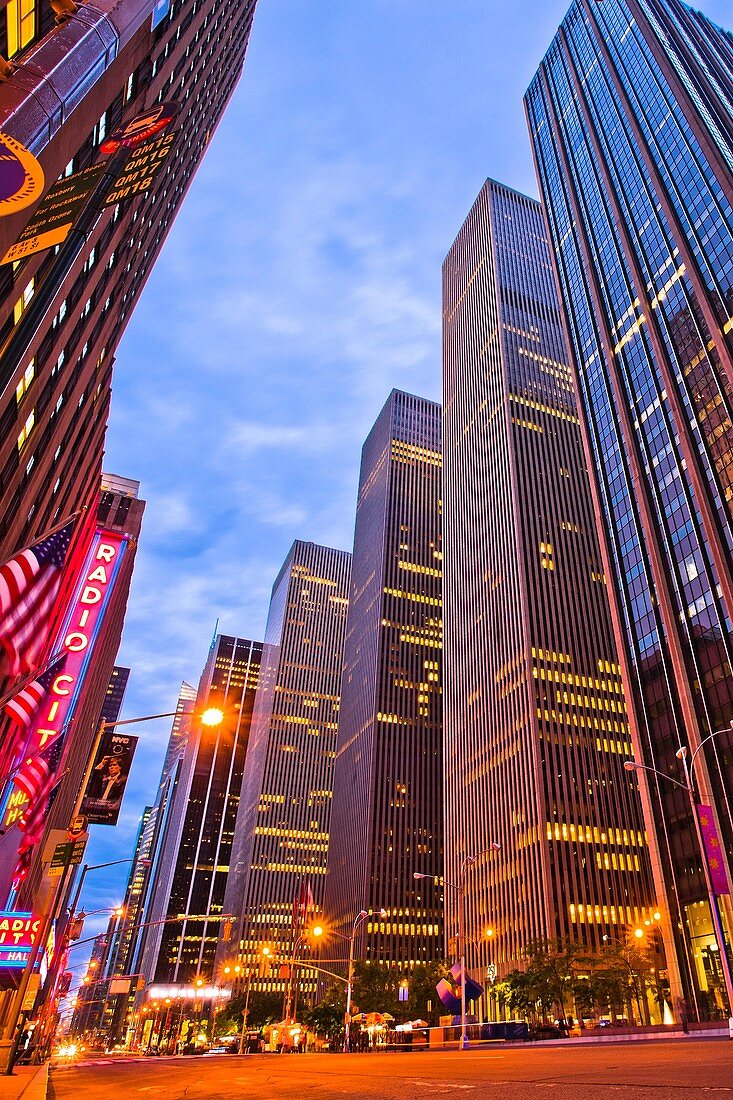 At left Radio City, Music Hall, Rockefeller Center, 6th Avenue, Sixth Avenue, Avenue of the Americas, Midtown, Manhattan, New York City, New York, USA