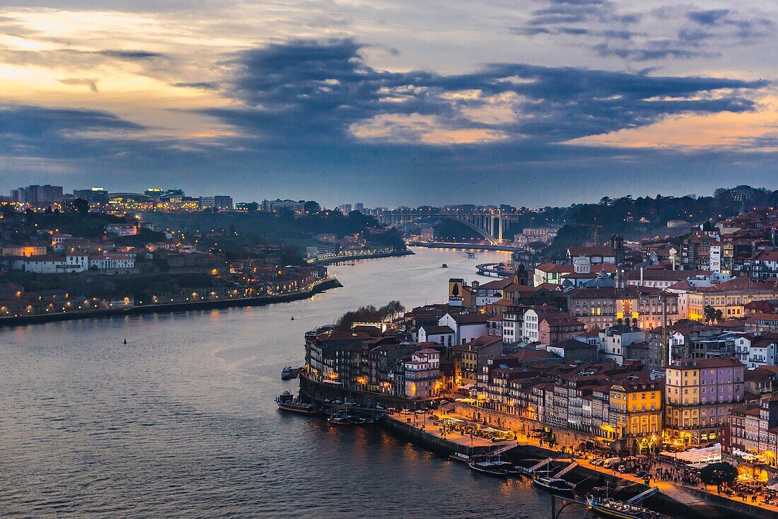 Sunset over Douro River and cities of Porto (right) and Vila Nova de Gaia, Portugal