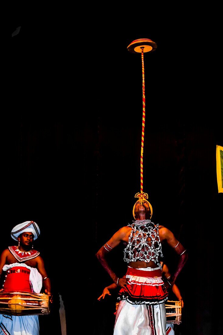 Balancing spinning disks, 'Dances of Sri Lanka' cultural performance, Kandy, Central Province, Sri Lanka