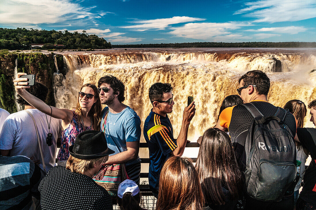 Selfie takers at the Garganta del Diablo (Devil's Throat), Iguazu Falls, UNESCO World Heritage Site, Iguazu, Argentina, South America