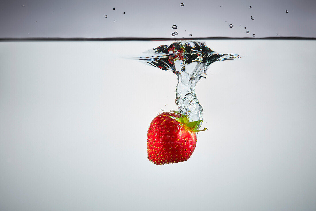 Close-up of strawberry in splashing water