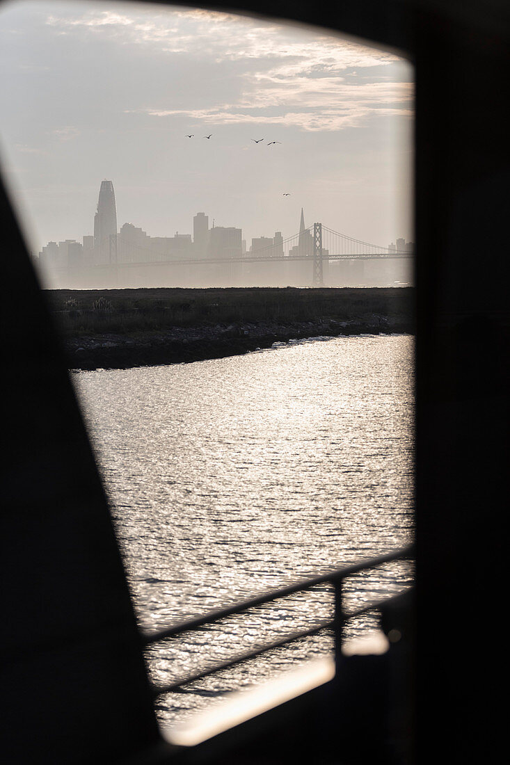 View through window of city, Oakland, California, USA