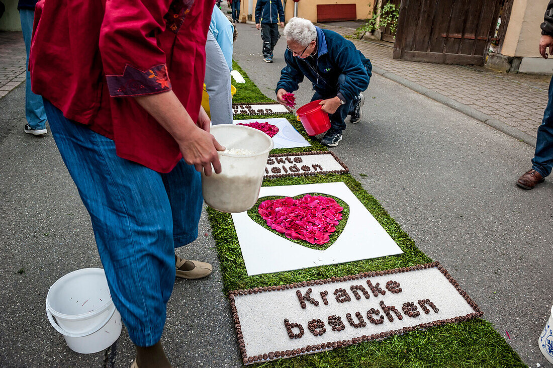 People arranging petals for the flower carpet, Corpus Christi, Feast of Corpus Christi, procession, Sipplingen, Lake Constance, Baden-Wuerttemberg, Germany, Europe