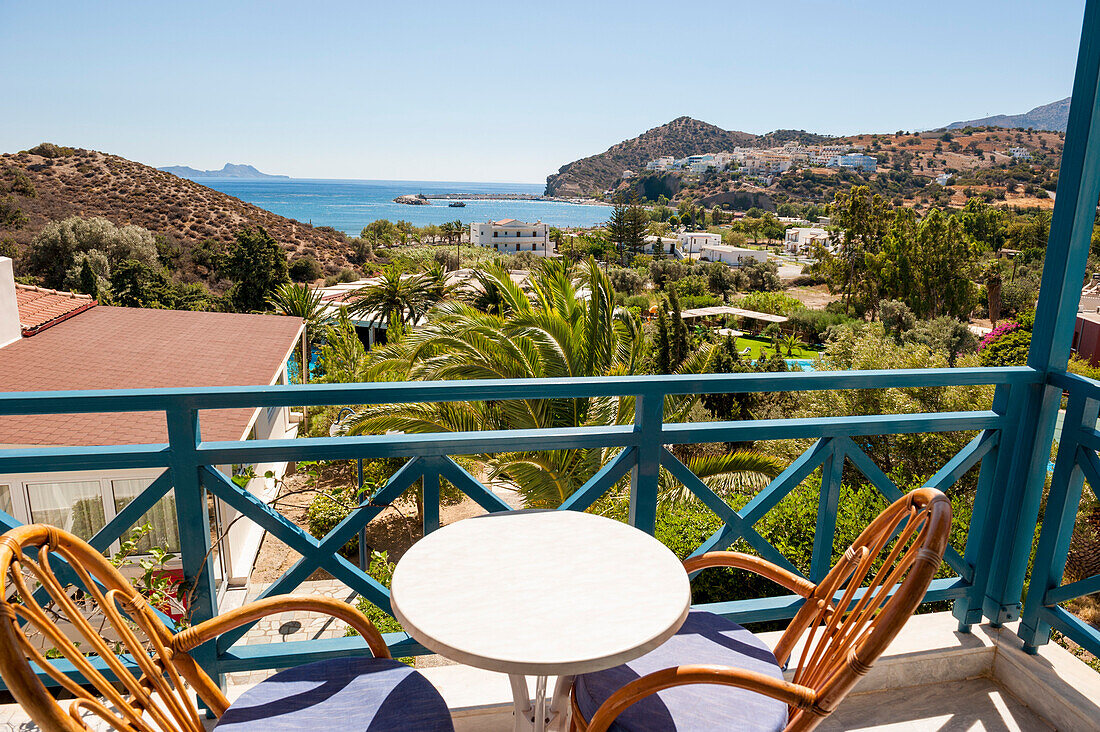 Hotel balcony overlooking a garden and pool, Agia Galini, Crete, Greece, Europe