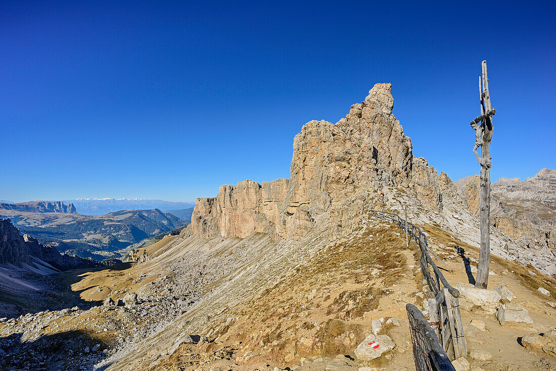 Rock spires and crucifix in Puez group, Dolomites, UNESCO World Heritage Site Dolomites, Venetia, Italy