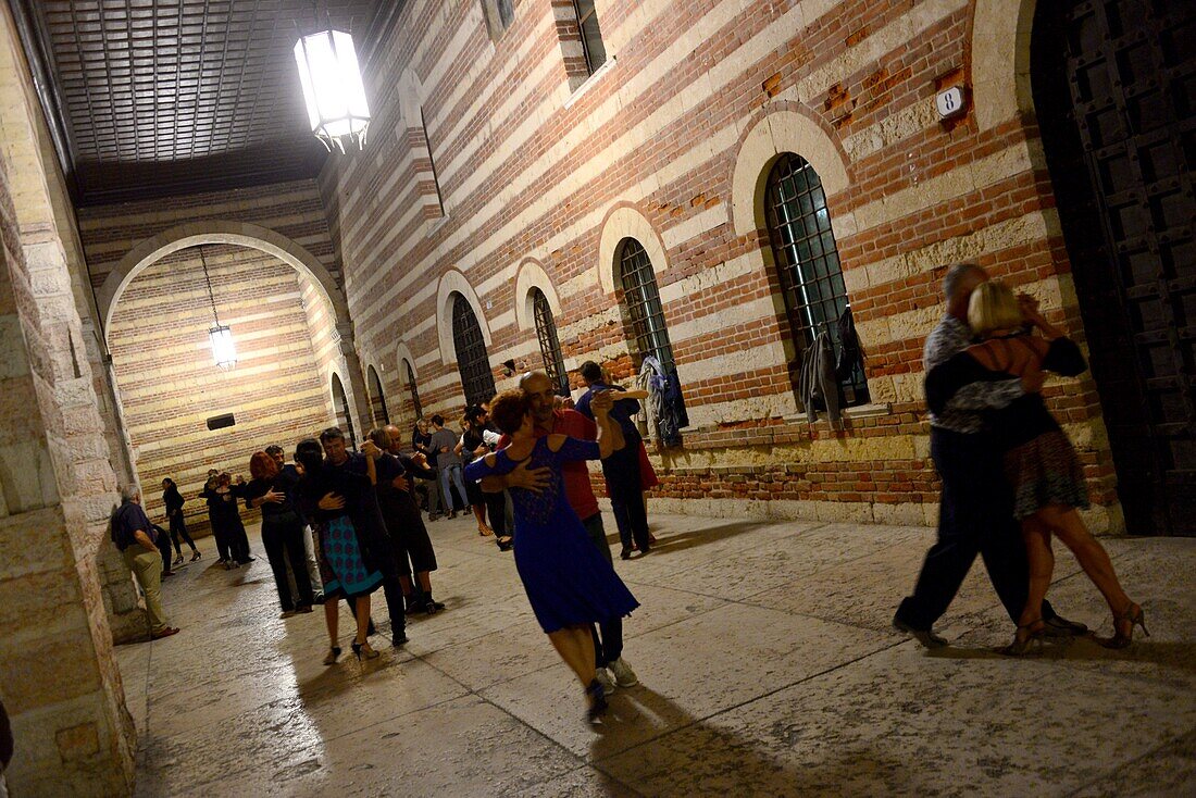 People dancing in the Palazzo della Regione at Piazza dei Signor, Verona, Venetian, Italy