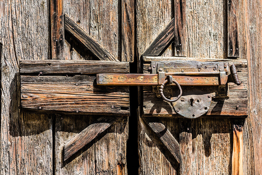 An old door lock to a wooden shed on the wine route, Margreid, South Tyrol, Alto Adige, Italy