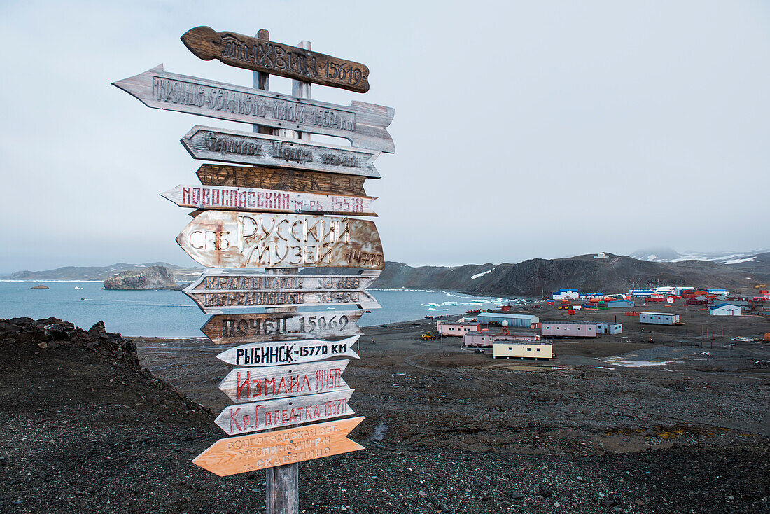 Distance signpost near Russian Orthodox church, King George Island, South Shetland Islands, Antarctica