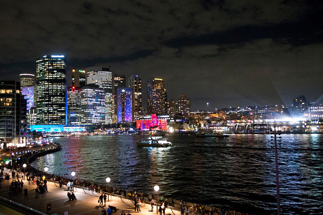 The ferry terminal of Circular Quay with city during the Vivid Festival, Sydney, New South Wales, Australia