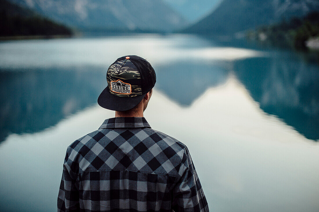 Man standing at Plansee, Reutte, Tirol, austria, europe.