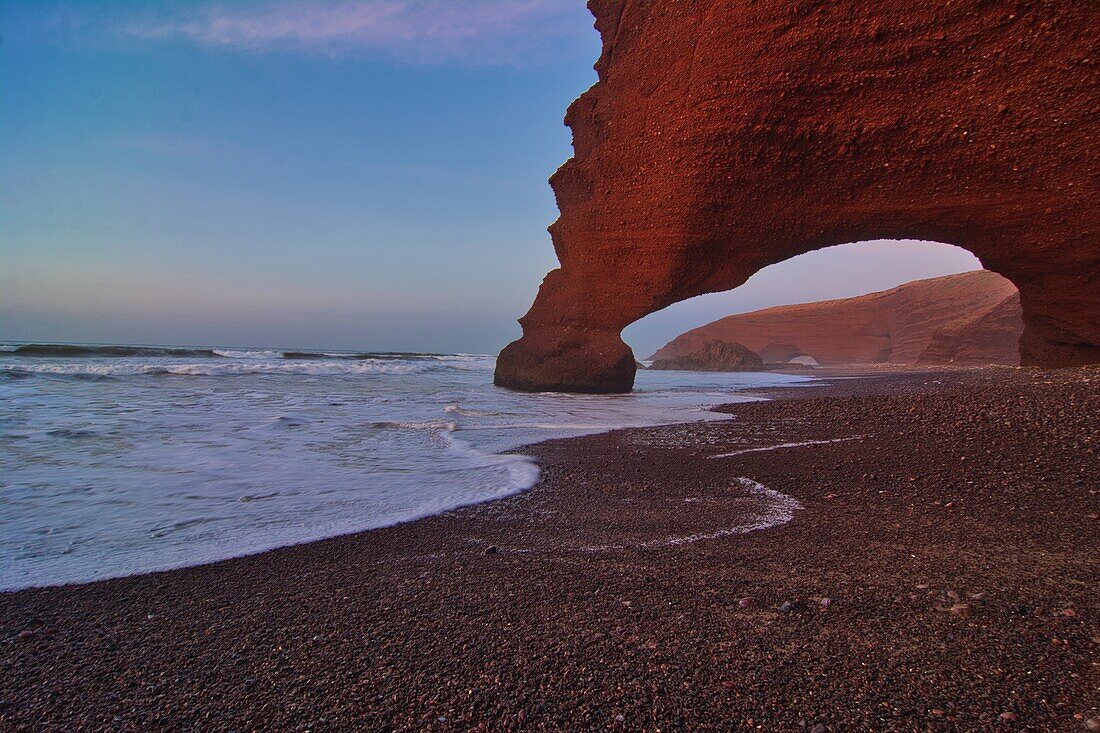 Steep escarpment with bizarre rock formations, Legzira near Sidi Ifni, Tiznit, Morocco