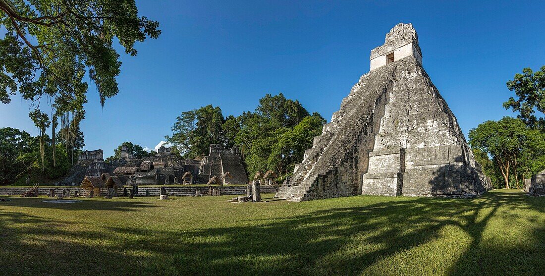 Temple I, or Temple of the Great Jaguar, is a funerary pyramid dedicated to Jasaw Chan K'awil, who was entombed in the structure in AD 734. The pyramid was completed around 740â. “750 and rises 47 meters or154 feet high. Tikal National Park, Guatemala, is